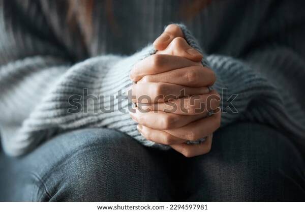 Person looking distracted and overwhelmed at a desk